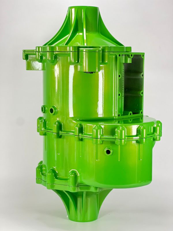 Bright green high-gloss model of an industrial component with bolted flanges and a cutaway window showing an internal cavity