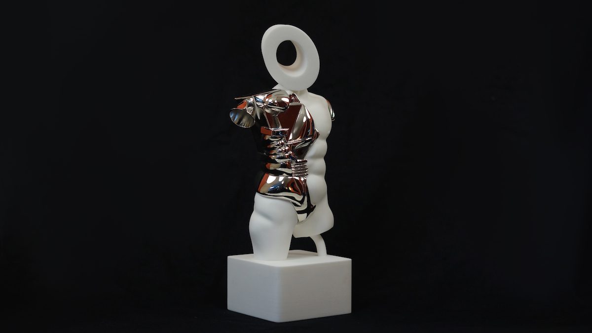 White torso sculpture with mirror-chrome plated sections on a white block against a black background